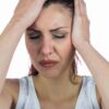 Headache hands on head