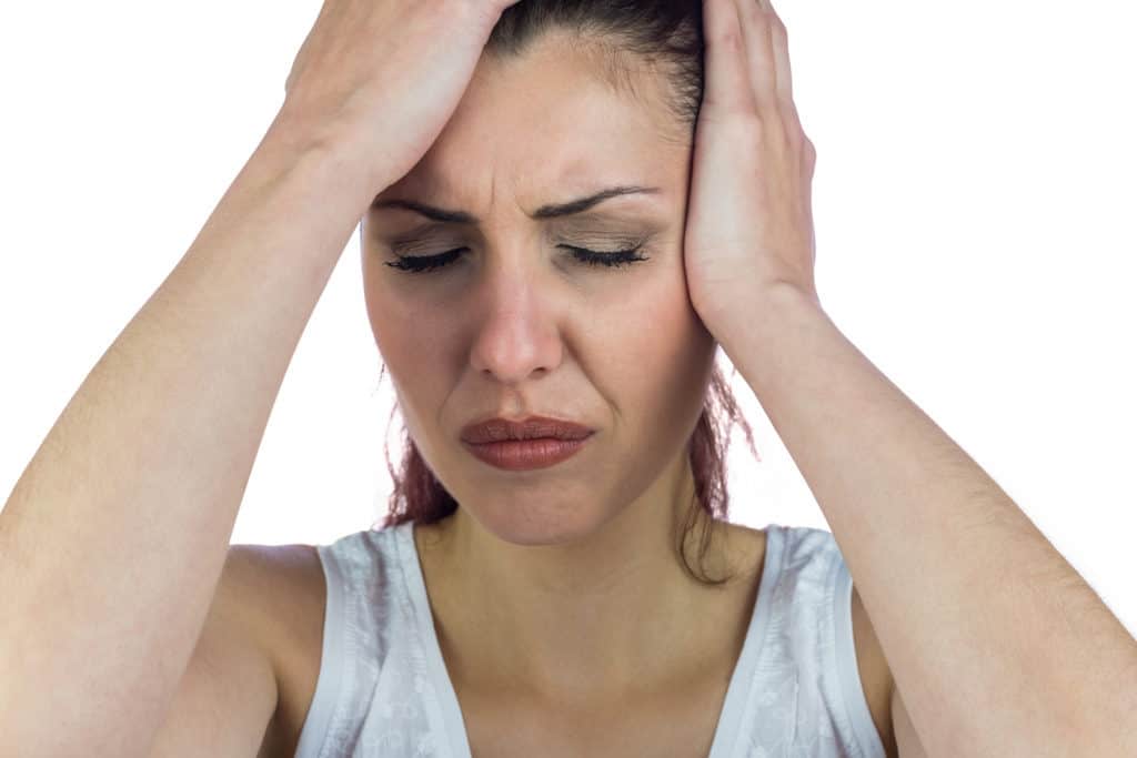 Headache hands on head