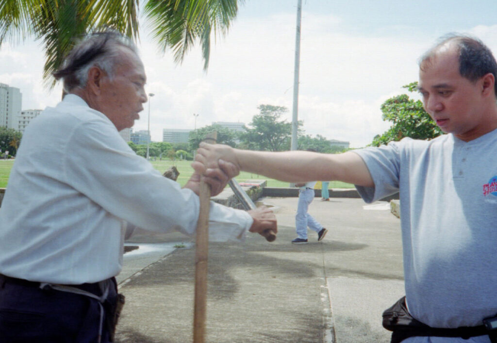 Antonio Tatang Ilustrisimo demonstrating a Kalis Ilustrisimo disarm on Christopher Topher Ricketts
